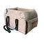 Beige pet carrier with black straps on a white background