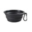 Black collapsible dog bowl with a carabiner on a white background