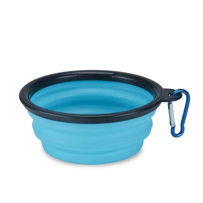Blue collapsible pet bowl with black rim and blue carabiner on a white background