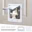Cat using a pet door with additional hardware components on a wooden door background