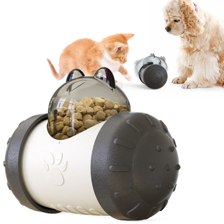 Happy dog nudging the Swing Bear Food Leaker to get treats while slowing down eating.