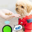 Dog wearing a red outfit with a hand feeding it, accompanied by a green button labeled 'PLAY'.