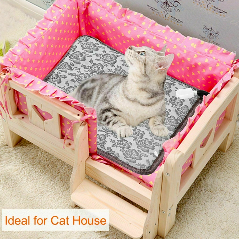 Cat lying on a small wooden bed with pink bedding