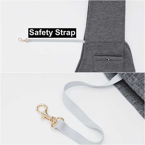 Gray dog leash with gold clip attached to a gray jacket, labeled 'Safety Strap'.