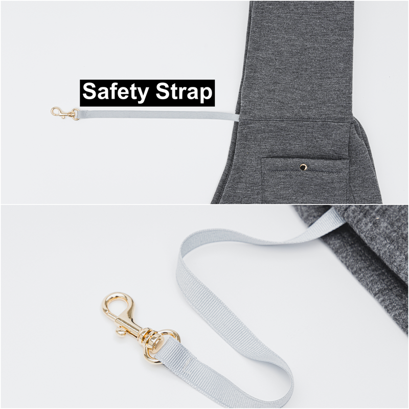 Gray dog leash with gold clip attached to a gray jacket, labeled 'Safety Strap'.
