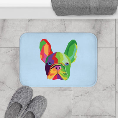 Colorful dog illustration on a light blue bath mat with gray slippers and towel on a marble floor.