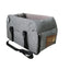 Gray pet carrier with a brown patch on a white background
