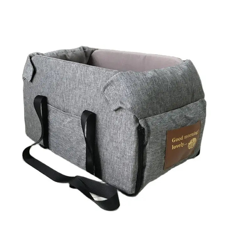 Gray pet carrier with a brown patch on a white background