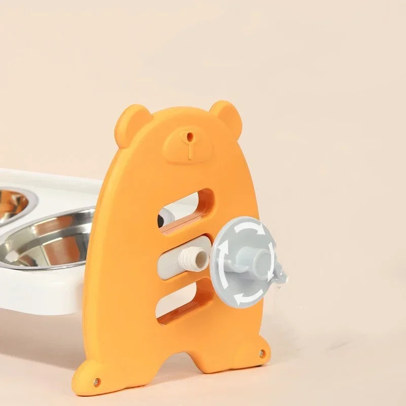Orange bear-shaped pet feeder with a white base on a beige background