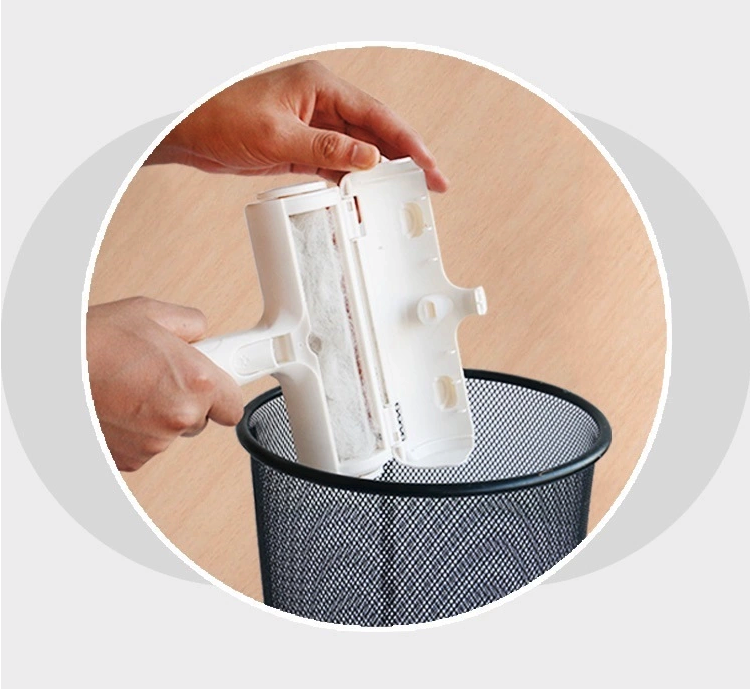A pet owner rolling the Yap & Paw™ device over a sofa to collect shed fur and dander.