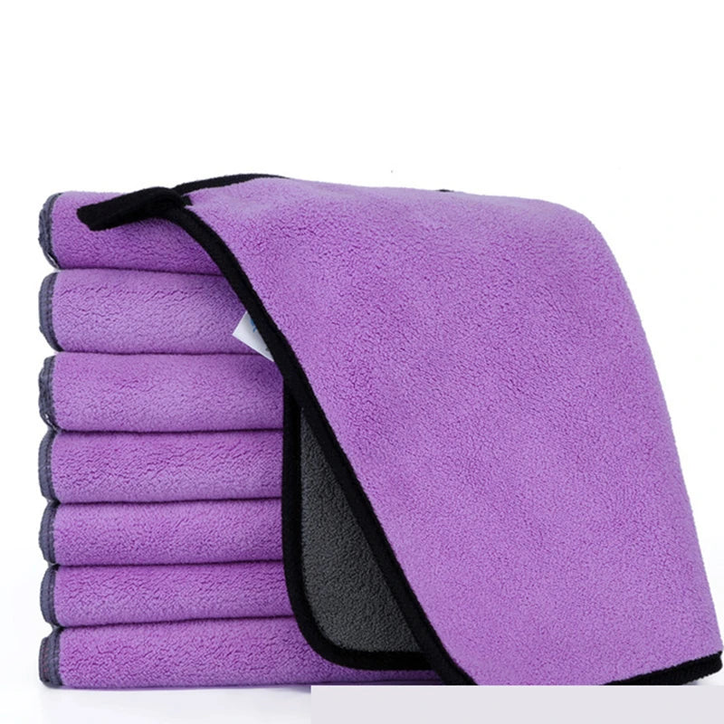 Purple towel with black border on a white background