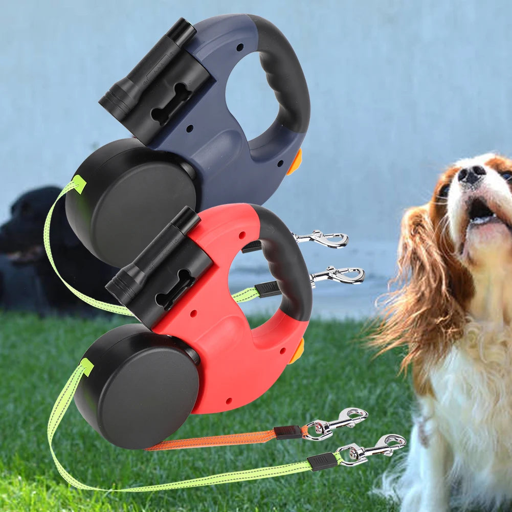 Retractable dog leashes in black, red, and green with a dog on grass in the background.
