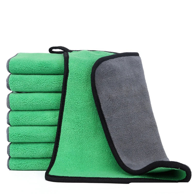 Set of green and gray microfiber cloths on a white background
