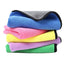 Stack of colorful microfiber towels on a white background