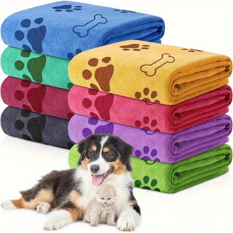 Stack of colorful pet blankets with paw and bone designs, featuring a dog and cat.