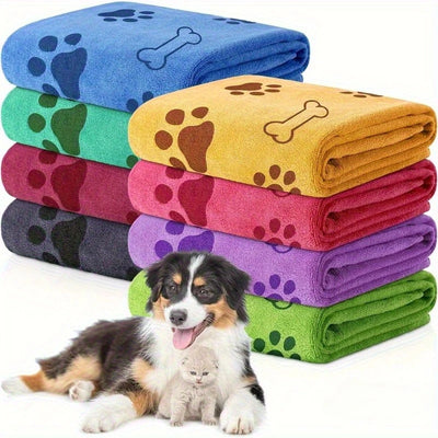 Stack of colorful pet blankets with paw and bone designs, featuring a dog and cat.