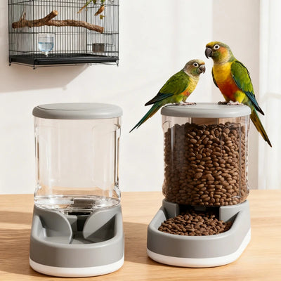 Two parrots perched on a bird feeder and water dispenser on a wooden surface.