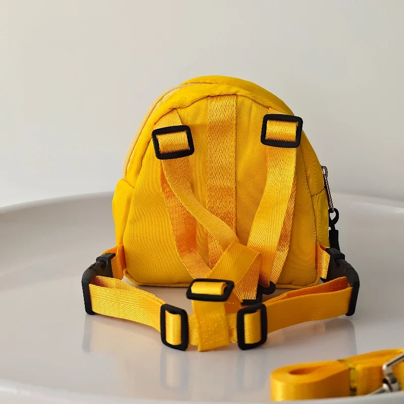 Yellow dog harness on a white background