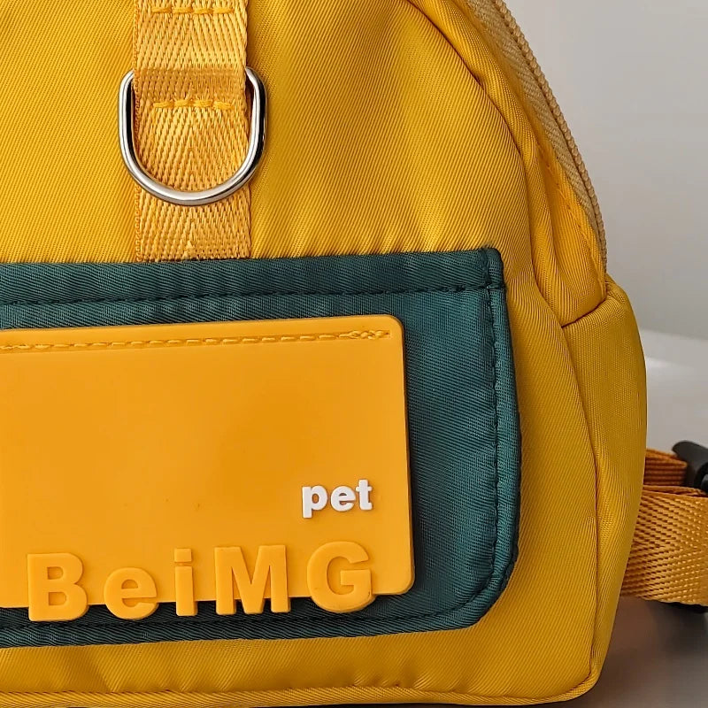 Yellow pet bag with a green pocket and 'pet BeiMG' branding on a white background