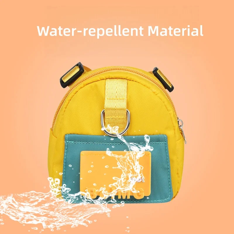 Yellow water-resistant bag with water splashing onto it on a peach background