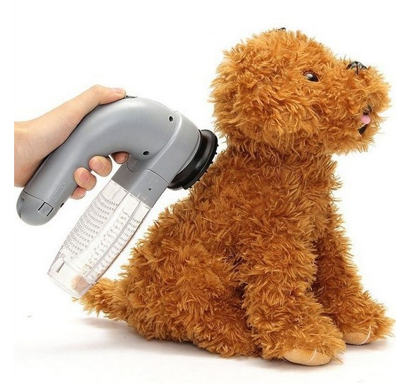 Plush dog toy being vacuumed by a handheld vacuum cleaner on a white background