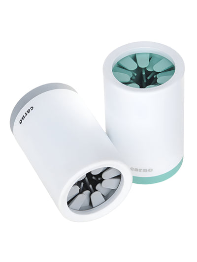 Two white cylindrical objects with green and black contents