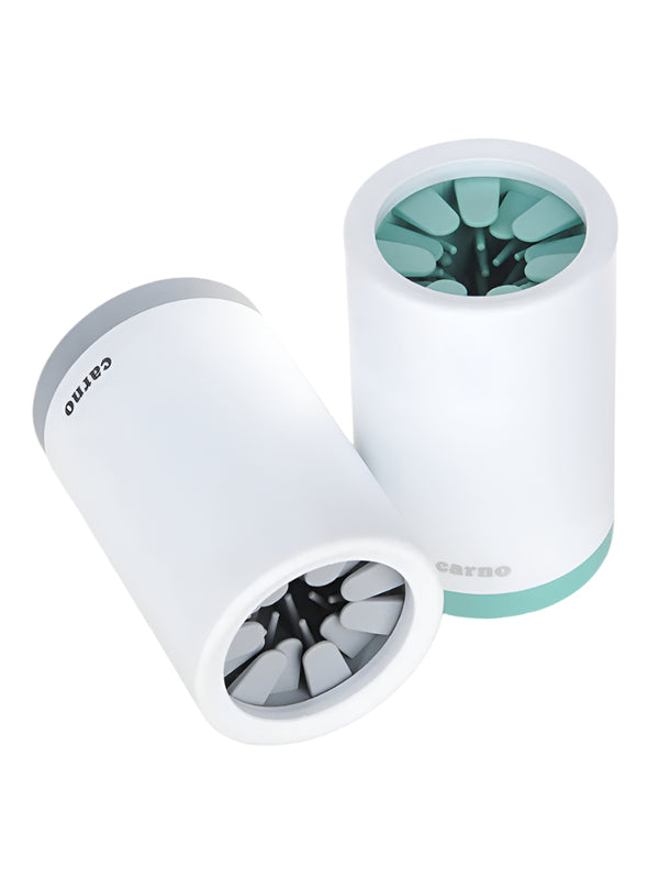 Two white cylindrical objects with green and black contents